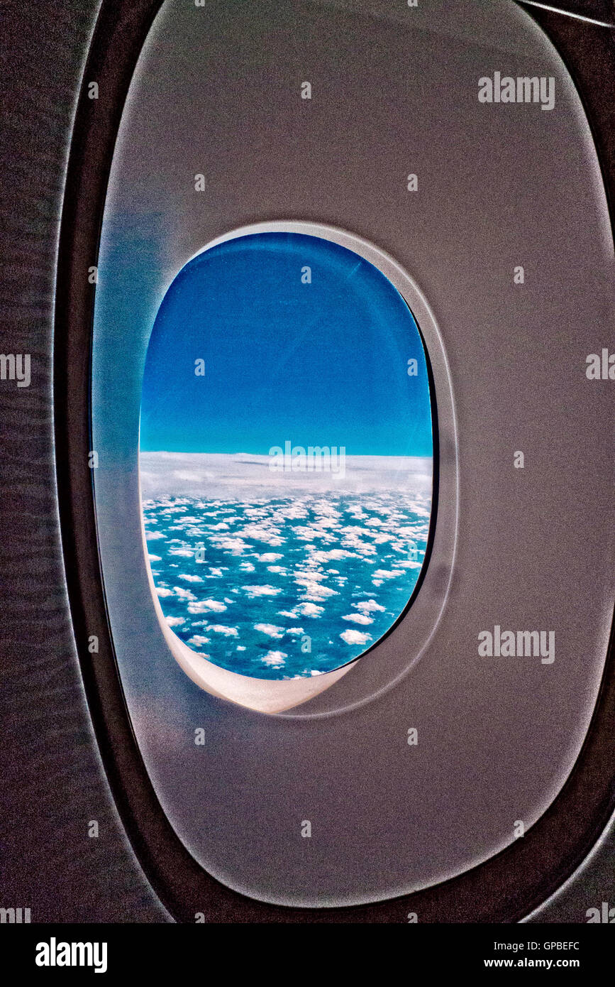 Airplane window showing sky and clouds Stock Photo - Alamy