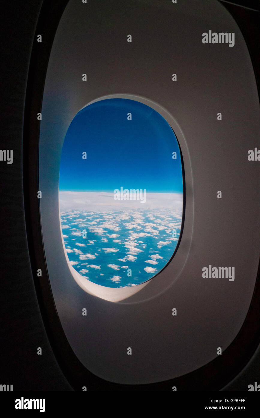 Airplane window showing sky and clouds Stock Photo - Alamy