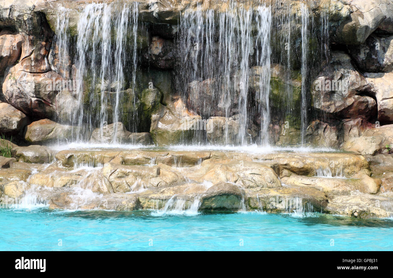 flowing waterfall in swimming pool Stock Photo Alamy