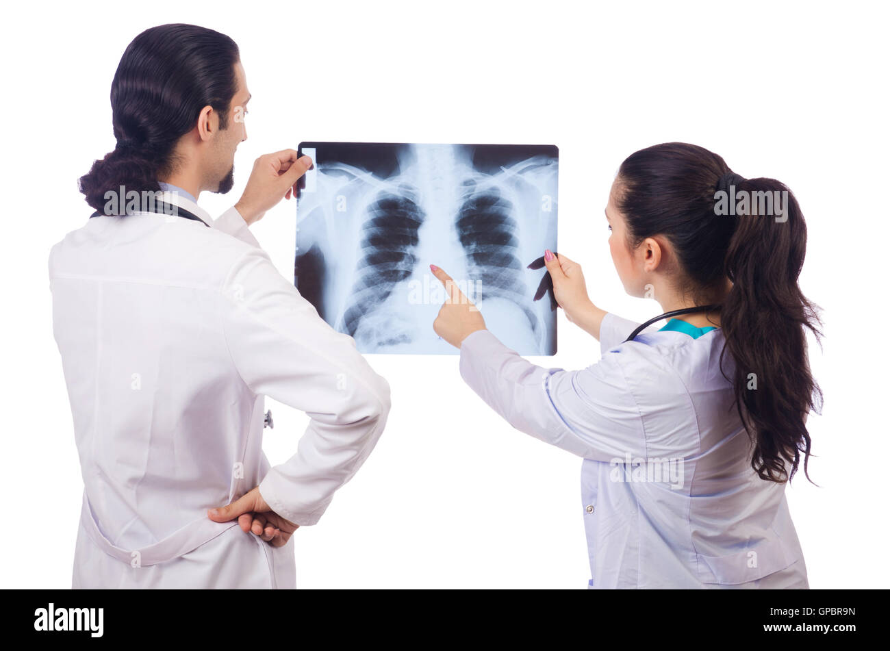 Two doctors looking at x-ray image on white Stock Photo - Alamy