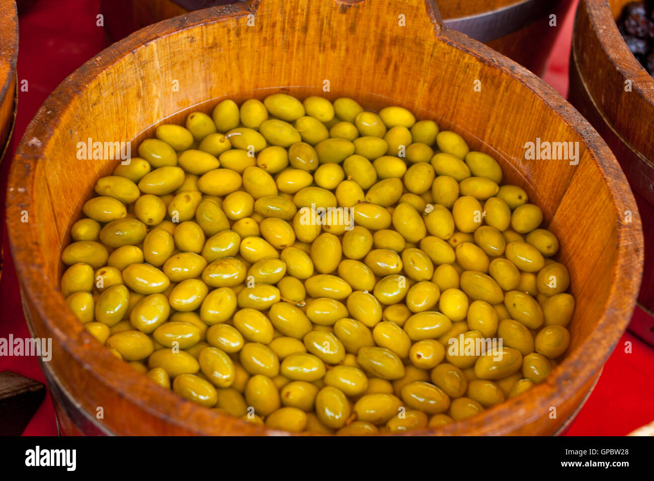 Green olives in a bucket Stock Photo Alamy
