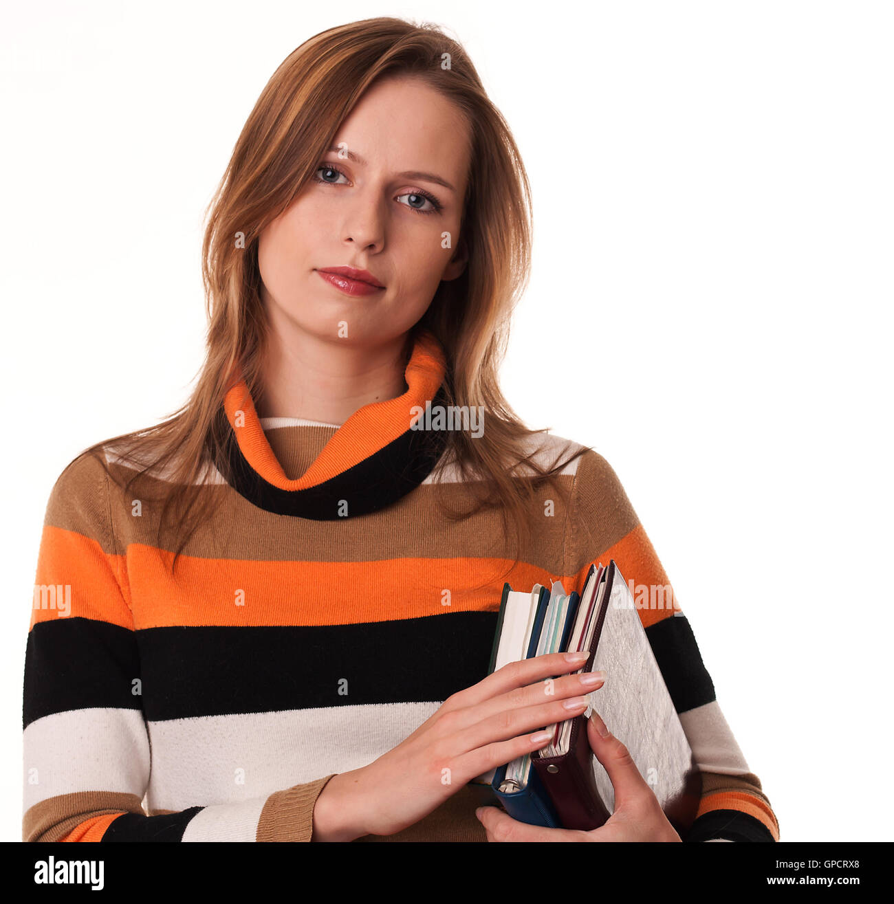 Young woman holding books under her arm Stock Photo Alamy