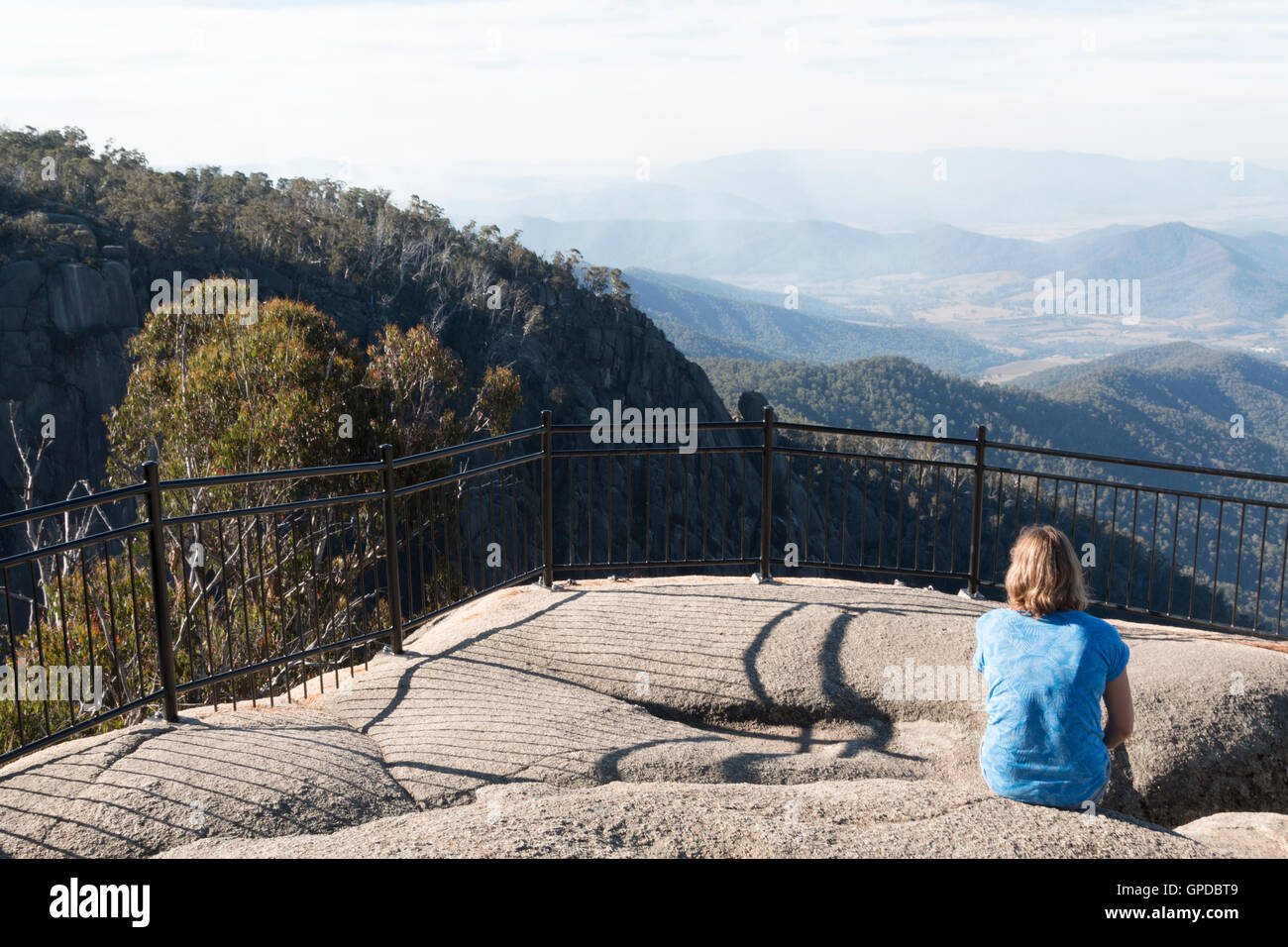 Woman admiring view at Mt Buffalo Lookout Stock Photo
