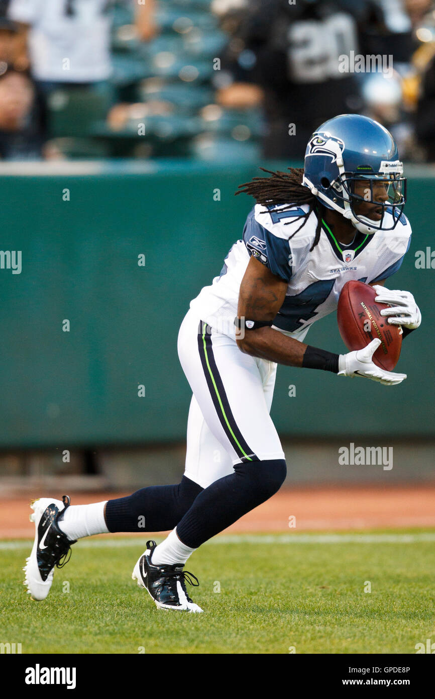 September 2, 2010; Oakland, CA, USA;  Seattle Seahawks cornerback Cord Parks (41) returns the opening kickoff during the first quarter against the Oakland Raiders at Oakland-Alameda County Coliseum. Oakland defeated Seattle 27-24. Stock Photo