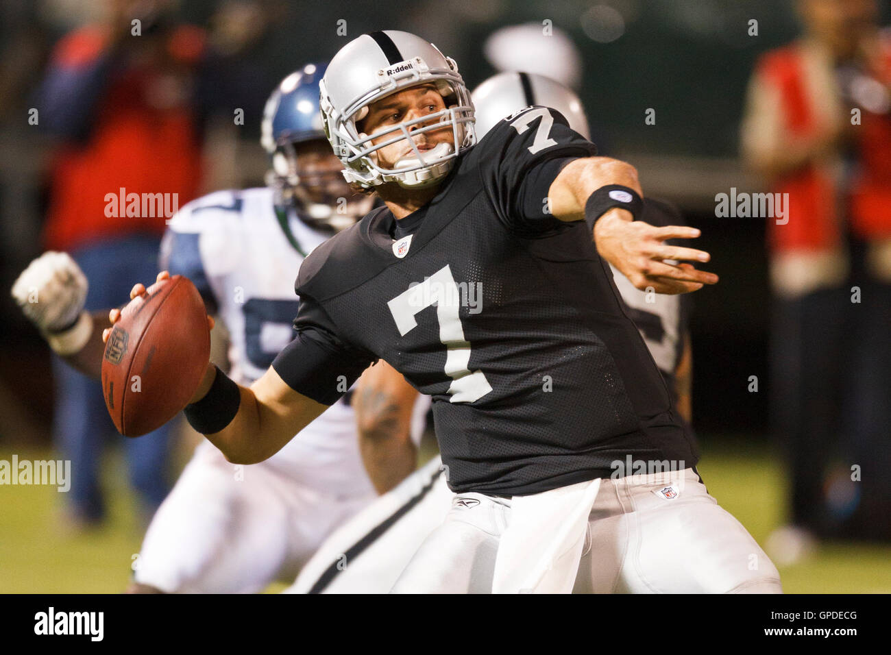 September 2, 2010; Oakland, CA, USA;  Oakland Raiders quarterback Kyle Boller (7) throws a 62 yard pass against the Seattle Seahawks during the third quarter at Oakland-Alameda County Coliseum. Stock Photo