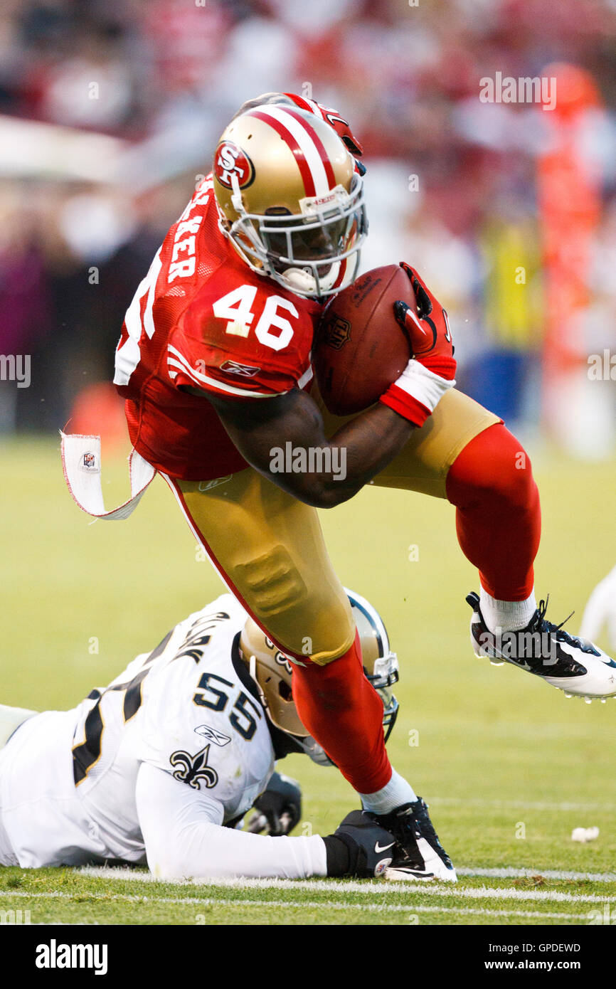 September 20, 2010; San Francisco, CA, USA;  San Francisco 49ers tight end Delanie Walker (46) breaks a tackle from New Orleans Saints linebacker Danny Clark (55) during the second quarter at Candlestick Park. New Orleans defeated San Francisco 25-22. Stock Photo