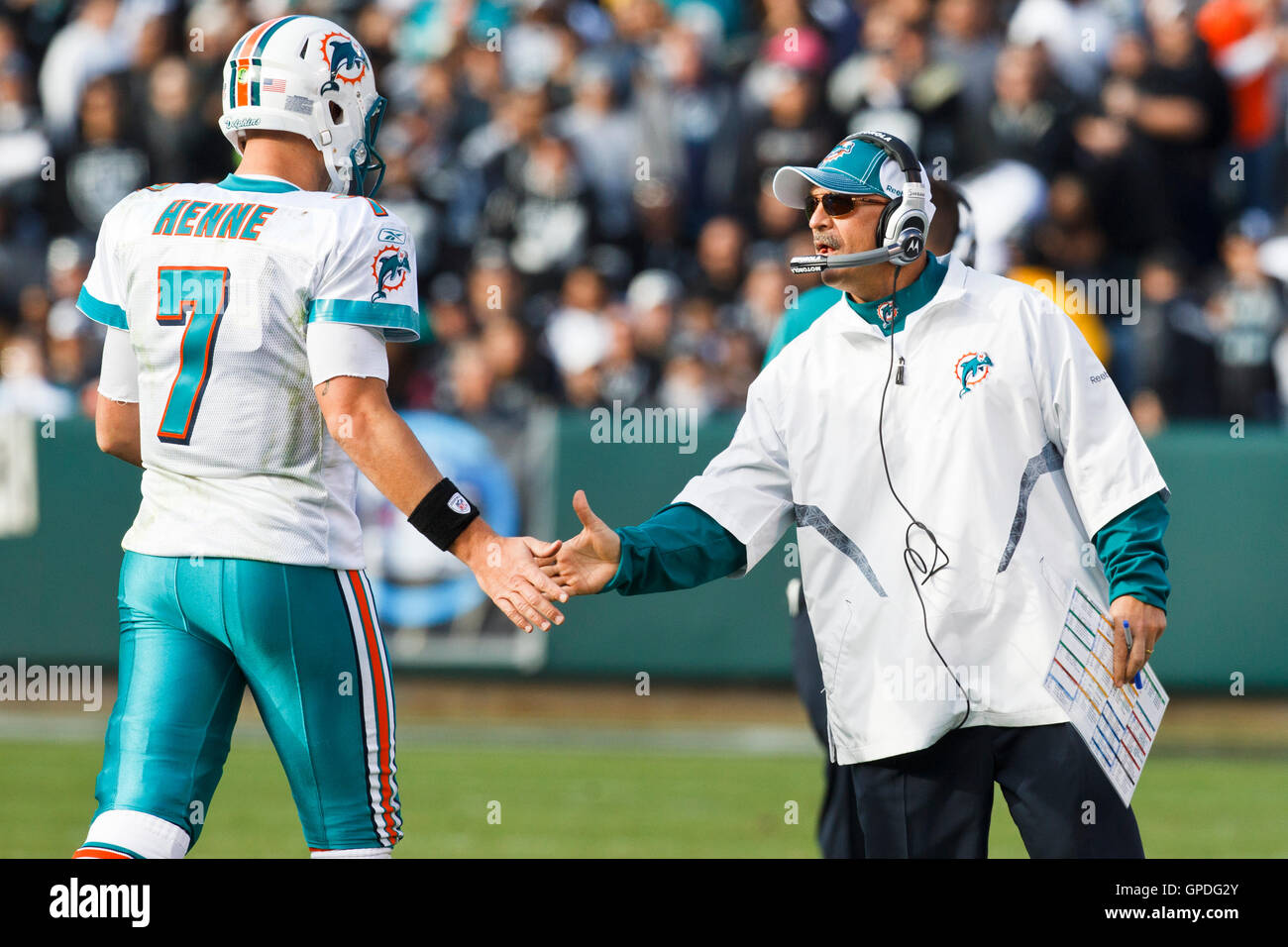 November 28, 2010; Oakland, CA, USA;  Miami Dolphins head coach Tony Sparano congratulates quarterback Chad Henne (7) after a drive against the Oakland Raiders during the second quarter at Oakland-Alameda County Coliseum. Stock Photo