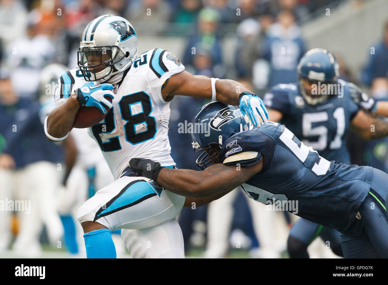 Carolina Panthers running back Jonathan Stewart, left, breaks free