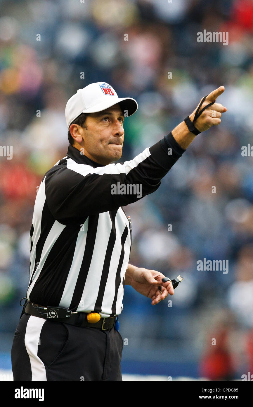 December 5, 2010; Seattle, WA, USA; NFL referee Gene Steratore (114)  signals for a first down