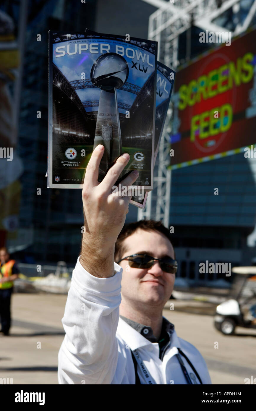Feb 6, 2011; Arlington, TX, USA; A vendor sells programs before Super Bowl XLV between the Green Bay Packers and the Pittsburgh Steelers outside of Cowboys Stadium. Stock Photo