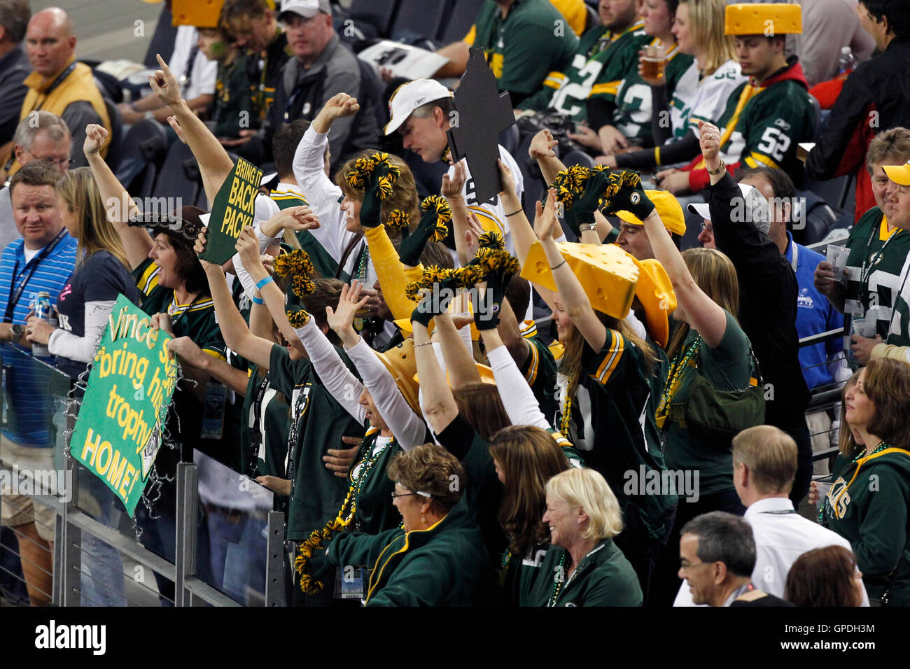 Feb 6, 2011; Arlington, TX, USA; Green Bay Packers fans cheer in the stands before Super Bowl XLV against the Pittsburgh Steelers at Cowboys Stadium. Stock Photo