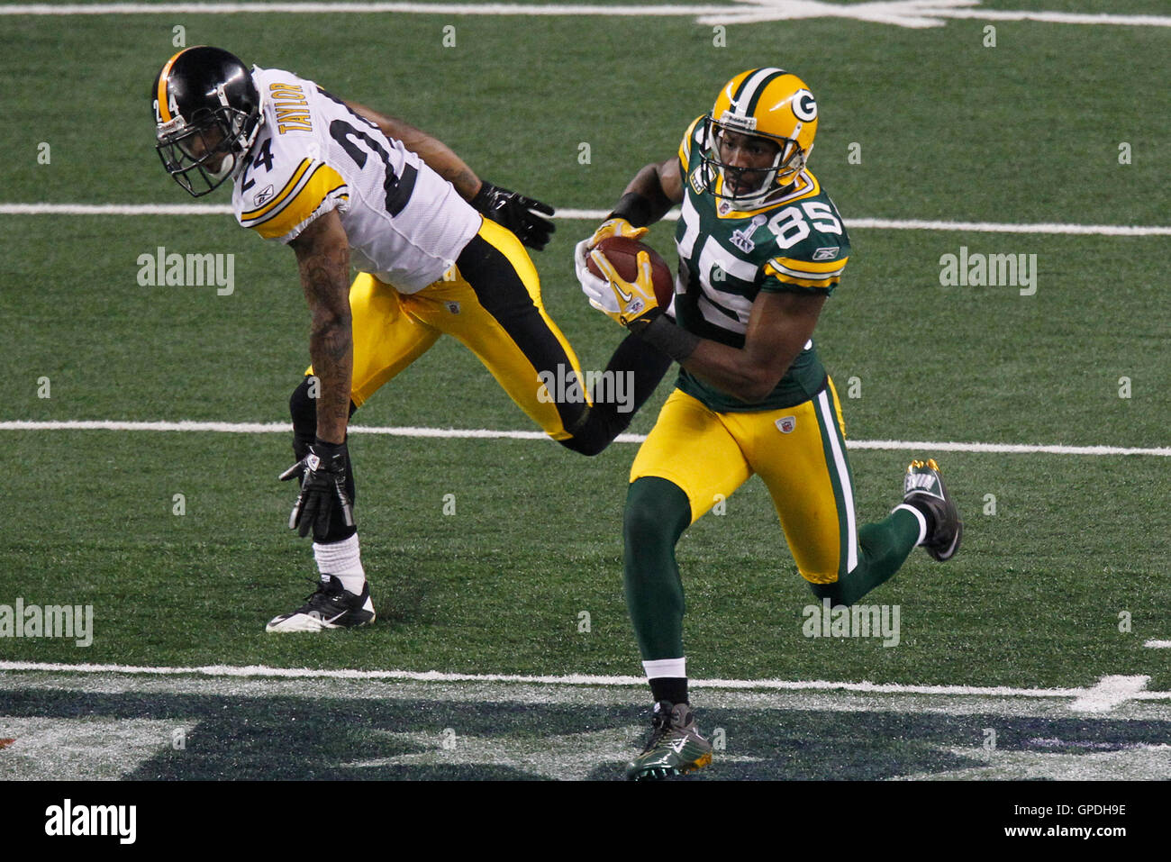 Pittsburgh Steelers head coach Mike Tomlin follows Pittsburgh Steelers  cornerback Ike Taylor (24) to the bench following the Detroit Lions 79 yard  touchdown pass in second quarter at November 17, 2013 at