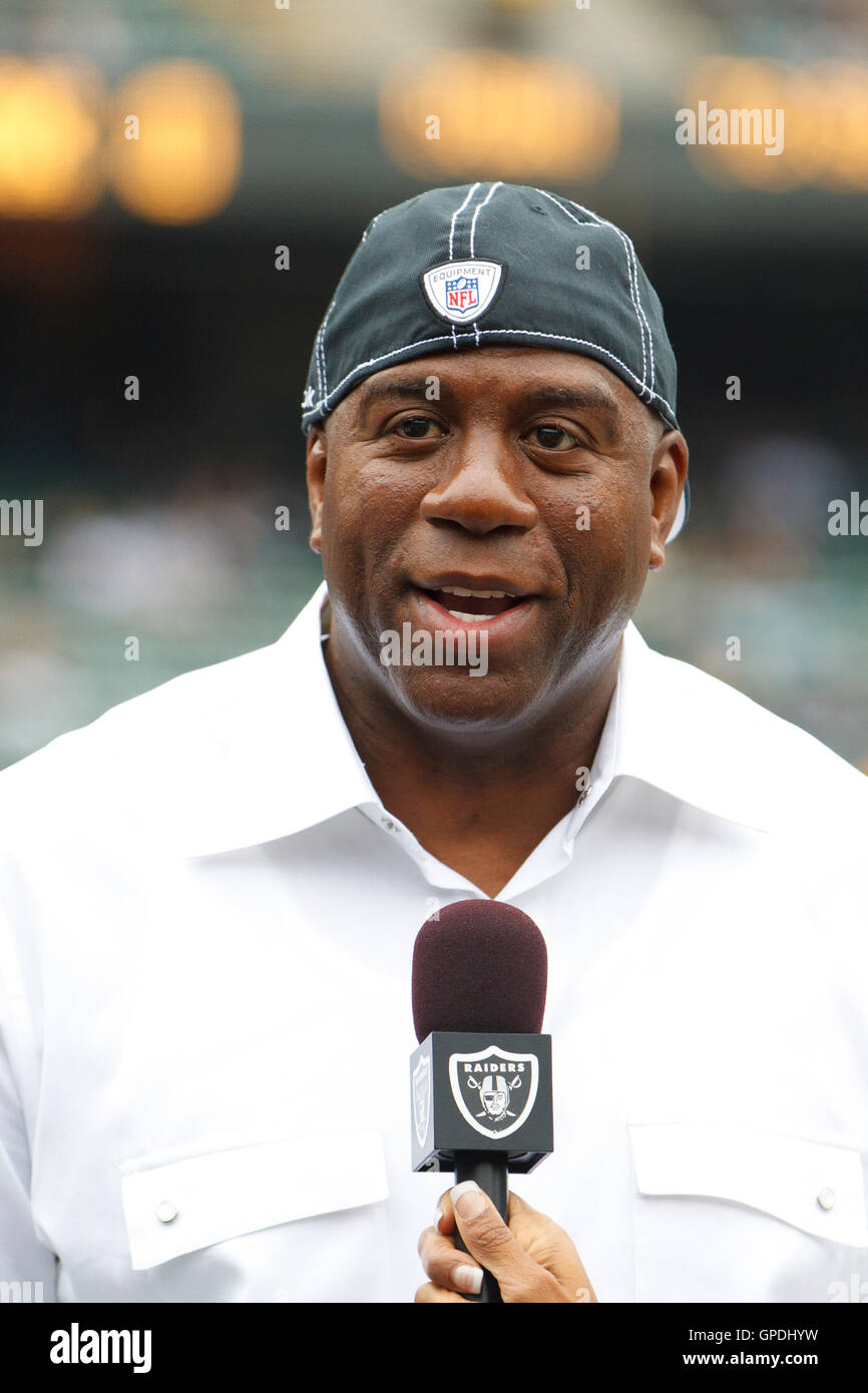 Sep 25, 2011; Oakland, CA, USA;  Los Angeles Lakers former player Magic Johnson on the sidelines before the game between the Oakland Raiders and the New York Jets at O.co Coliseum. Stock Photo