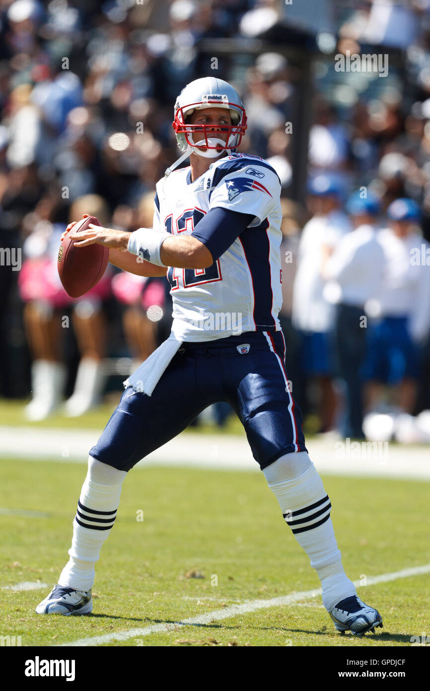 Oct 2, 2011; Oakland, CA, USA; New England Patriots quarterback Tom Brady (12) warms up before the game against the Oakland Raiders at O.co Coliseum. New England defeated Oakland 31-19. Stock Photo