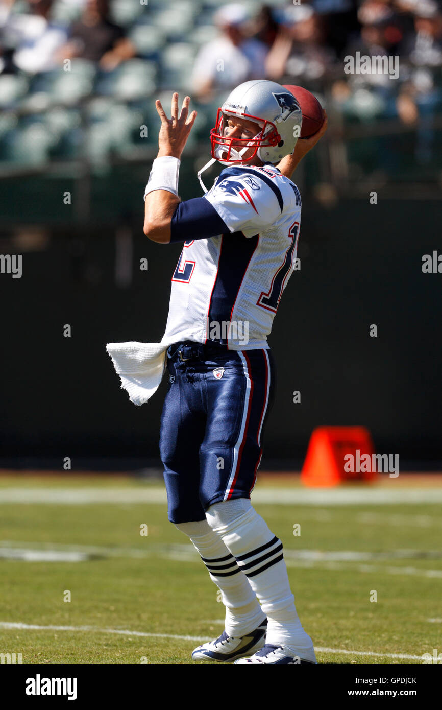 Oct 2, 2011; Oakland, CA, USA; New England Patriots quarterback Tom Brady (12) warms up before the game against the Oakland Raiders at O.co Coliseum. Stock Photo