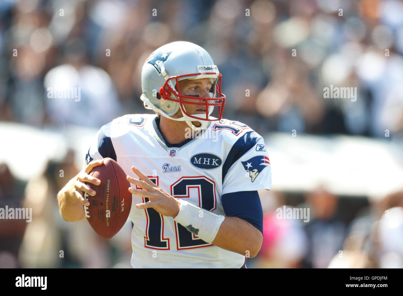 Oct 2, 2011; Oakland, CA, USA; New England Patriots quarterback Tom Brady (12) stands in the pocket against the Oakland Raiders during the first quarter at O.co Coliseum. Stock Photo