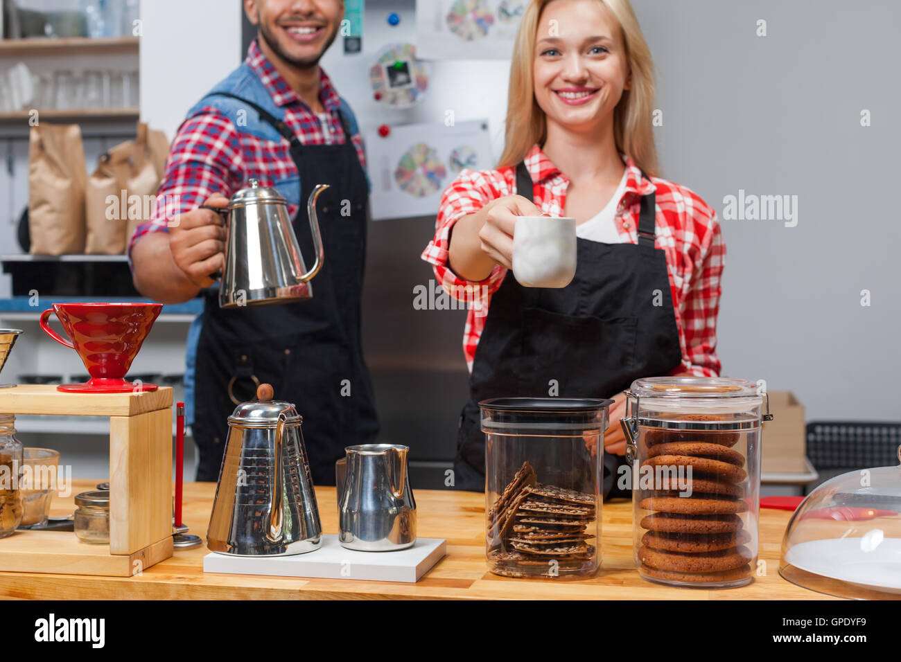 Barista coffee shop owner couple happy smile at bar counter Stock Photo
