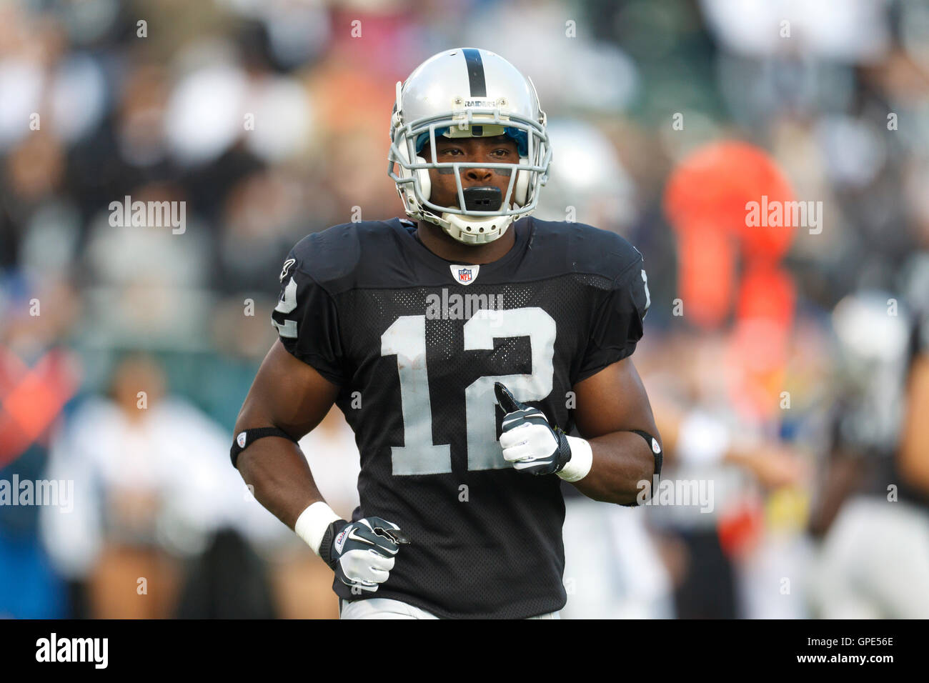 Oakland Raiders wide receiver Jacoby Ford (12) runs past the