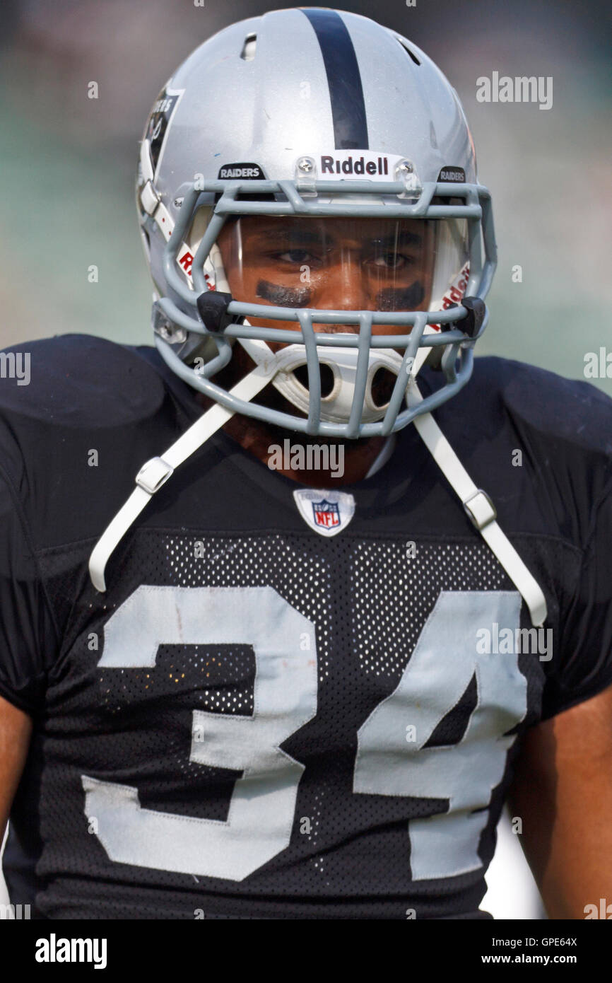 Nov 27, 2011; Oakland, CA, USA; Oakland Raiders defensive back Mike Mitchell (34) warms up before the game against the Chicago Bears at O.co Coliseum. Oakland defeated Chicago 25-20. Stock Photo