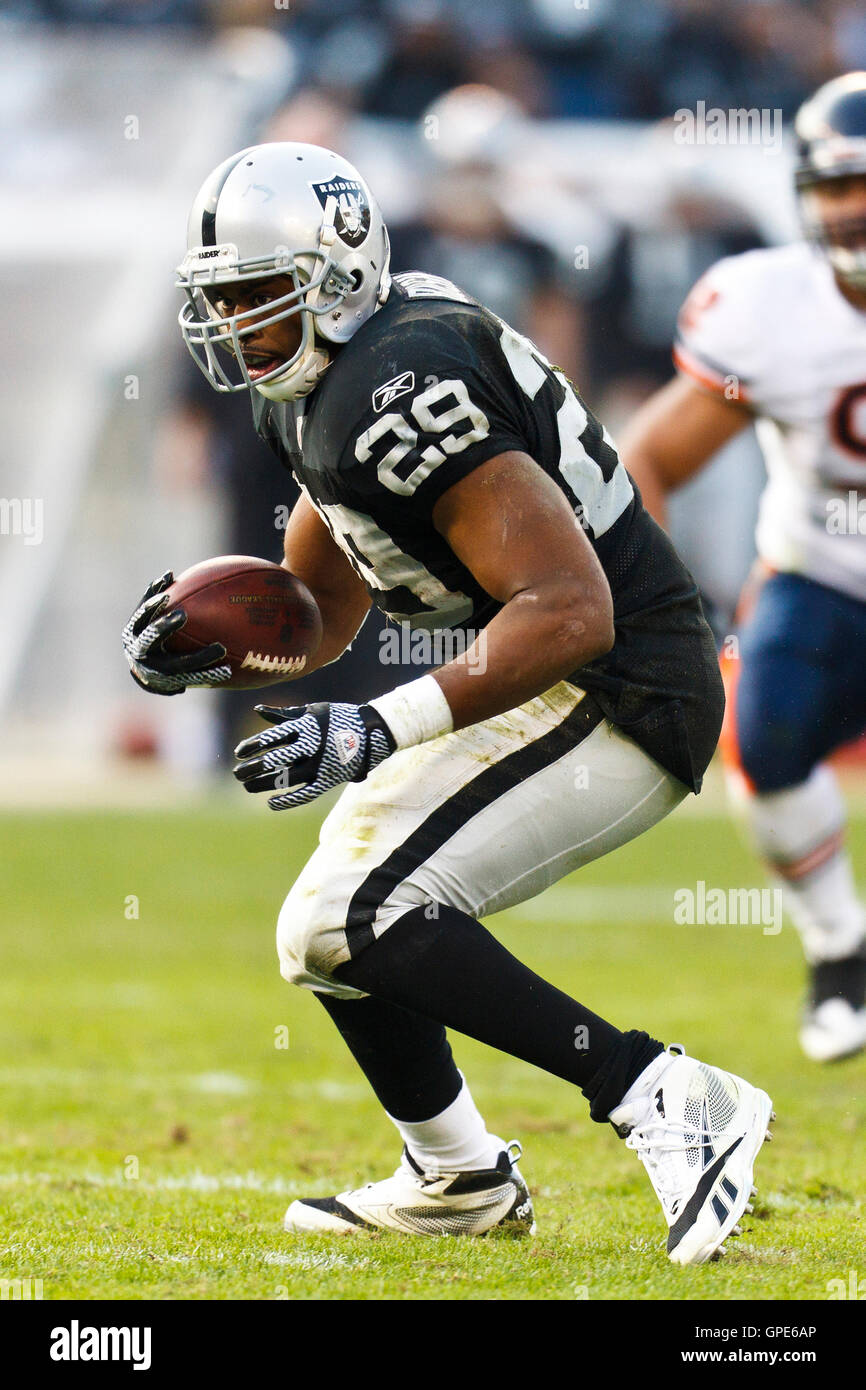 Nov 27, 2011; Oakland, CA, USA; Oakland Raiders running back Michael Bush (29) rushes up field against the Chicago Bears during the fourth quarter at O.co Coliseum. Oakland defeated Chicago 25-20. Stock Photo