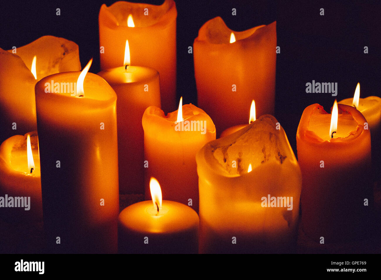 Glowing orange candles Stock Photo Alamy