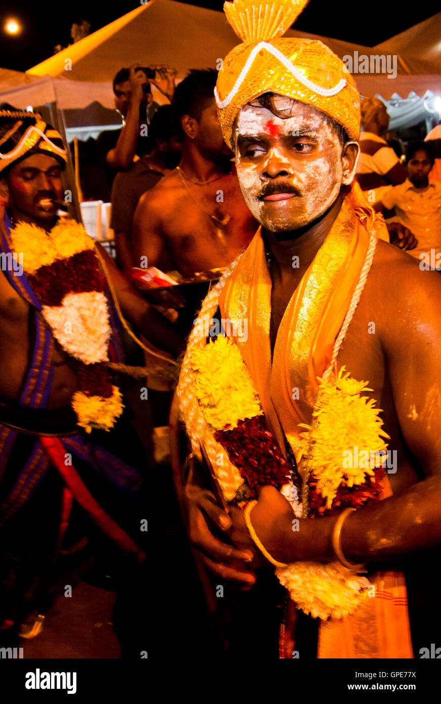 An entranced man waits for the procession to start at the Thaipusam