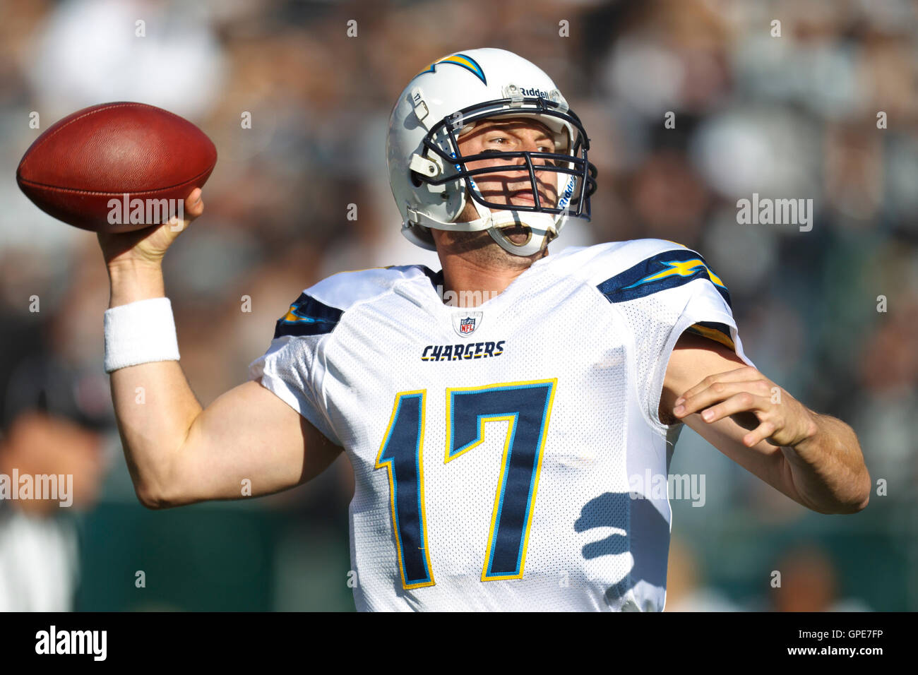 Jan 1, 2012; Oakland, CA, USA; San Diego Chargers quarterback Philip Rivers (17) passes the ball against the Oakland Raiders during the first quarter at O.co Coliseum. Stock Photo