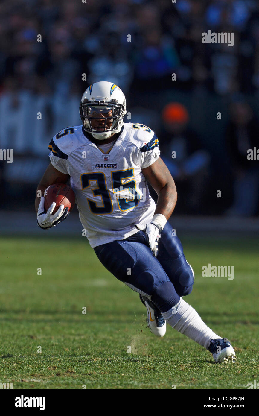 Jan 1, 2012; Oakland, CA, USA; San Diego Chargers running back Mike Tolbert (35) rushes up field against the Oakland Raiders during the second quarter at O.co Coliseum. Stock Photo