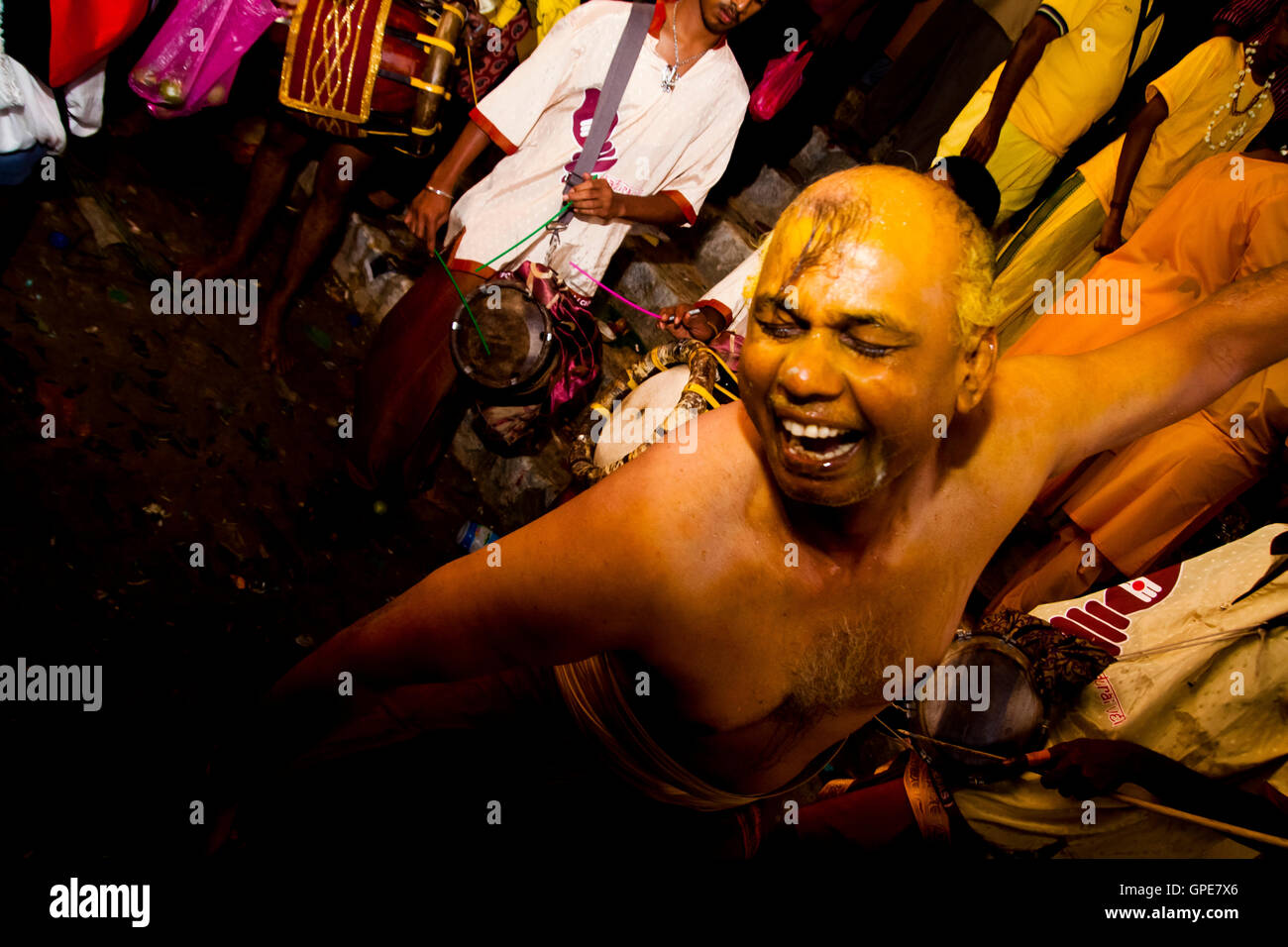 A man prepares to enter a trance and be pierced at the Thaipusam festival, Batu Caves, Malaysia. Stock Photo