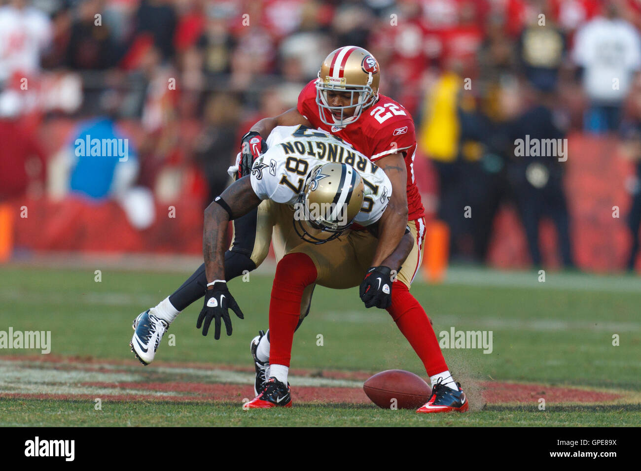 Jan 14, 2012; San Francisco, CA, USA; San Francisco 49ers cornerback Carlos Rogers (22) breaks up a pass intended for New Orleans Saints wide receiver Adrian Arrington (87) during the third quarter of the 2011 NFC divisional playoff game at Candlestick Pa Stock Photo
