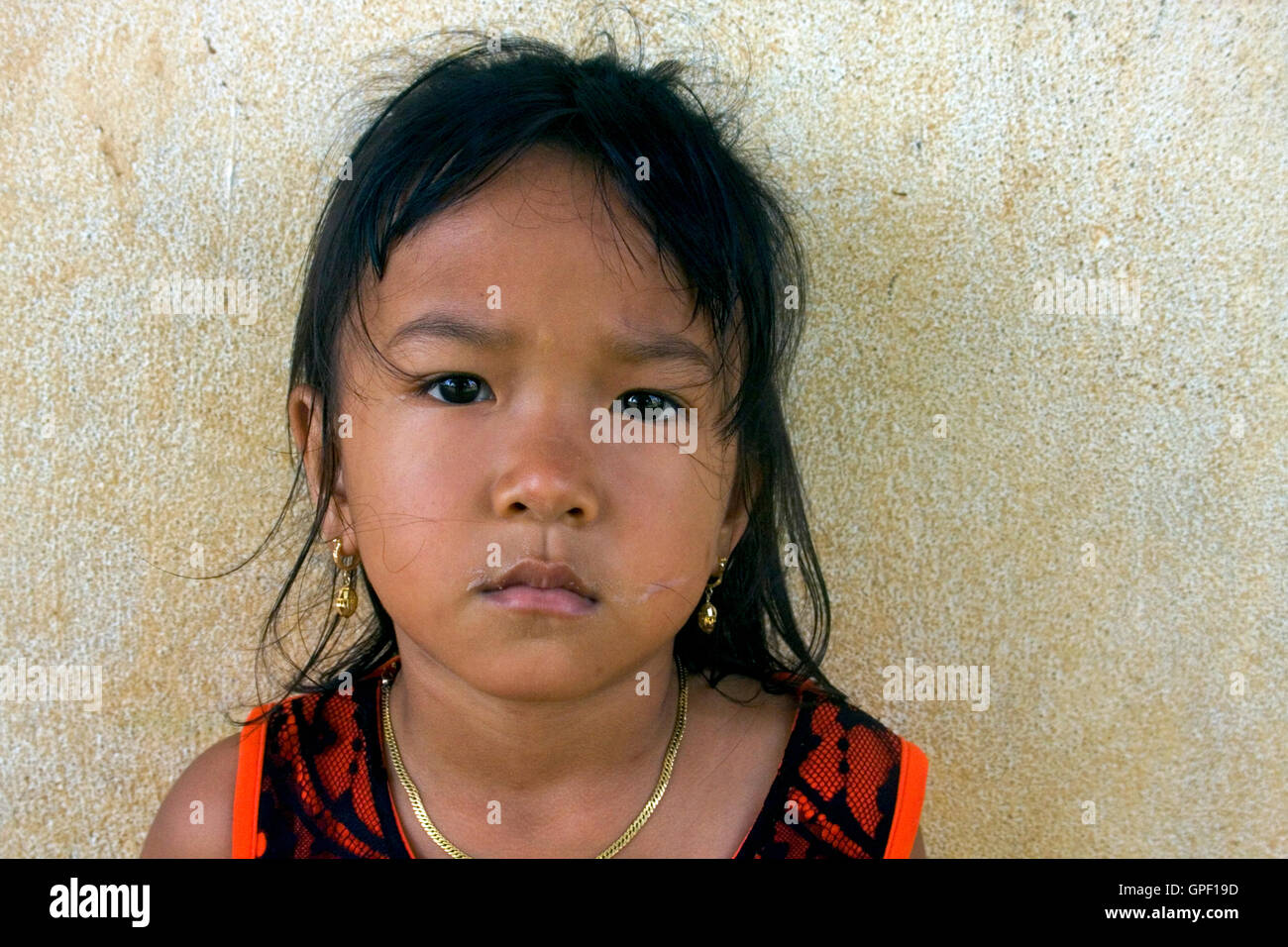 A young Khmer girl is posing for a portrait in Chork village, Cambodia ...