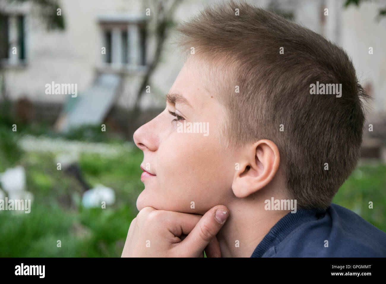 handsome teenager boy thinking about something. Stock Photo