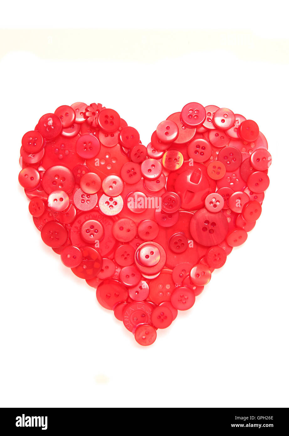 red buttons in shape of a heart cutout Stock Photo