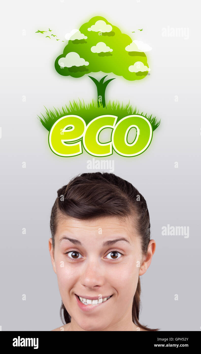 Young girl looking at green eco sign Stock Photo