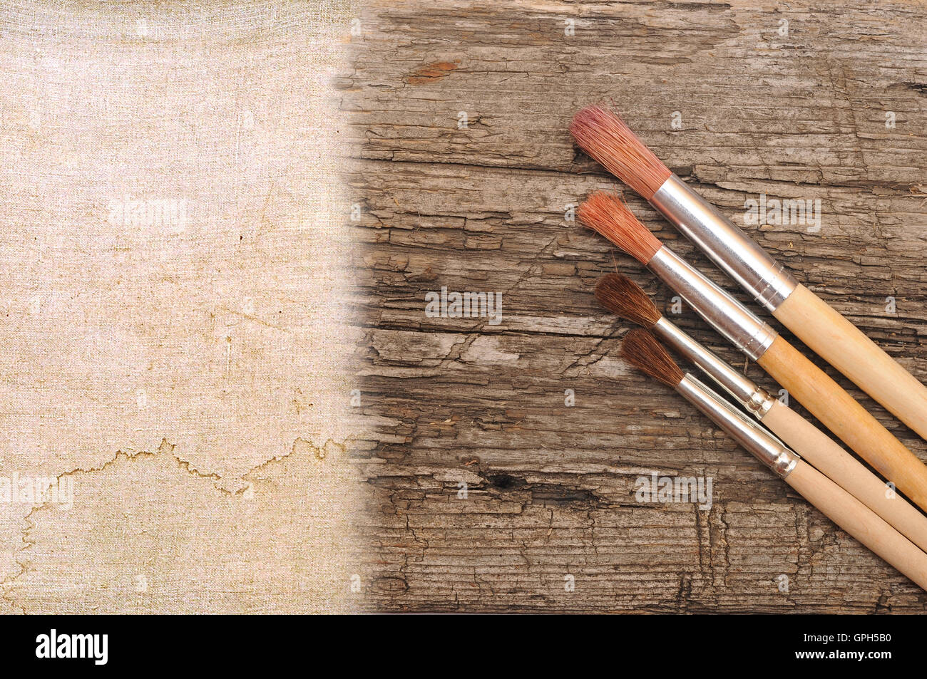 art paint brush on wood and canvas with space for text or image Stock Photo