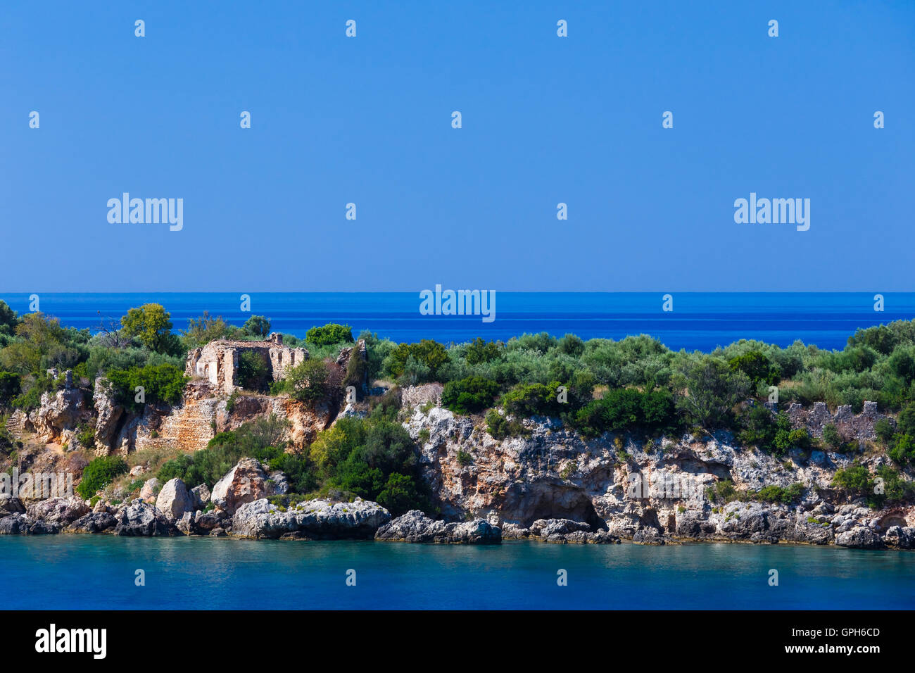 The old castle ruins in Meropi islet across Kardamili town, a coastal town built by the Venetians Stock Photo