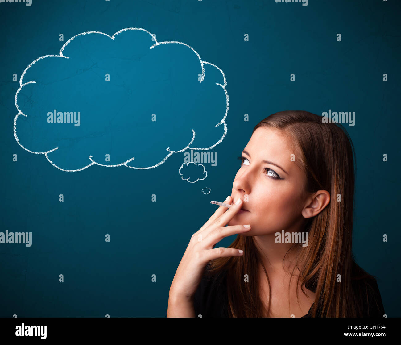 Beautiful lady smoking cigarette with idea cloud Stock Photo