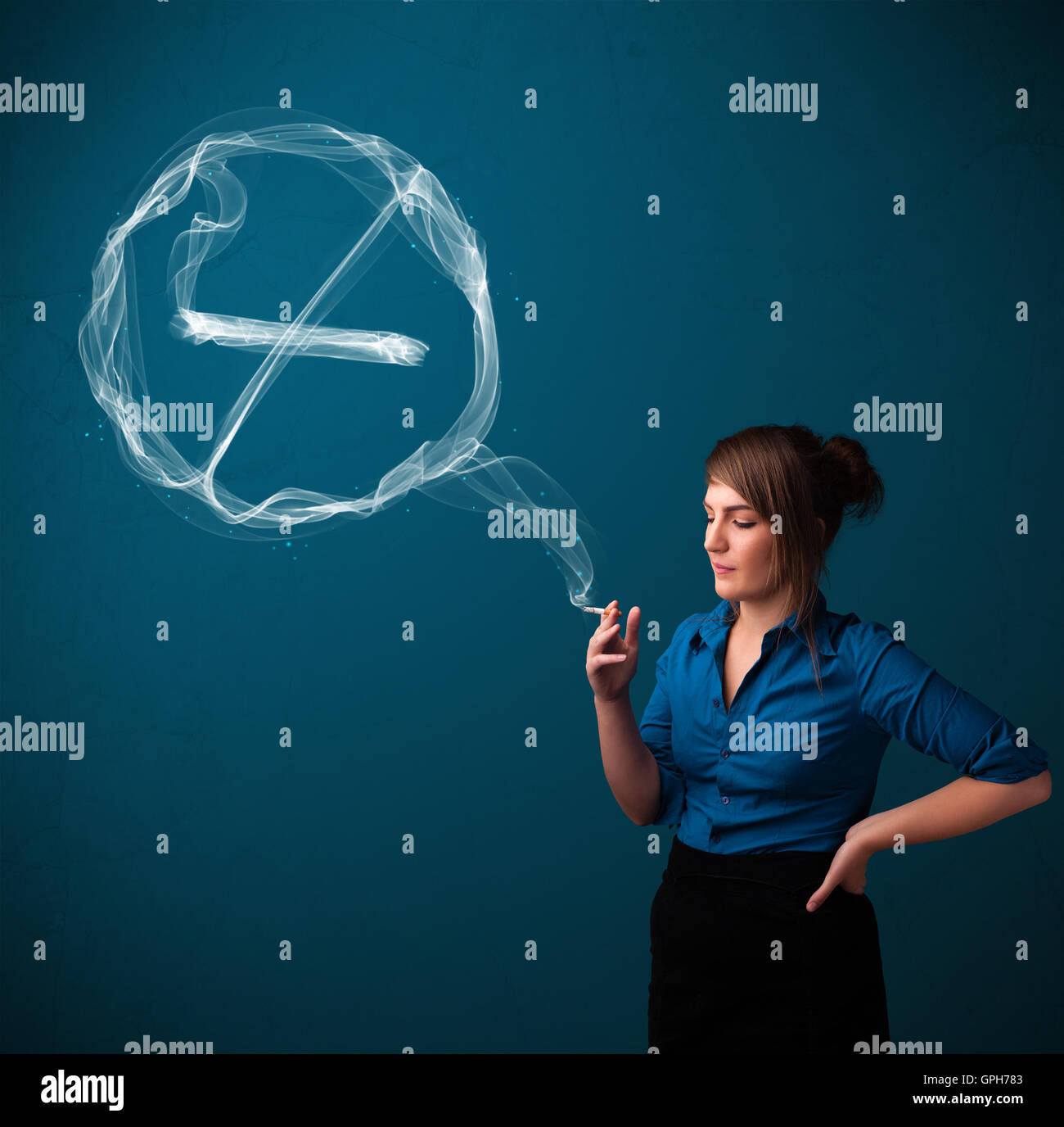 Young lady smoking unhealthy cigarette with no smoking sign Stock Photo