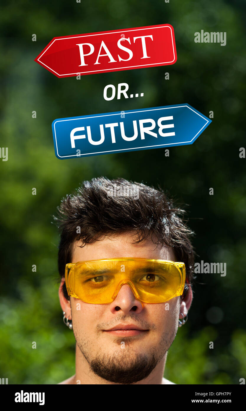 Young head looking at positive negative signs Stock Photo Alamy