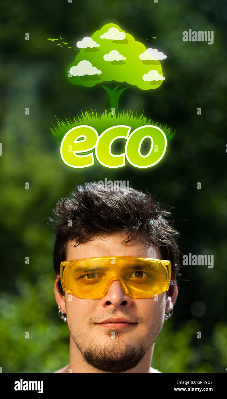 Young head looking at green eco sign Stock Photo