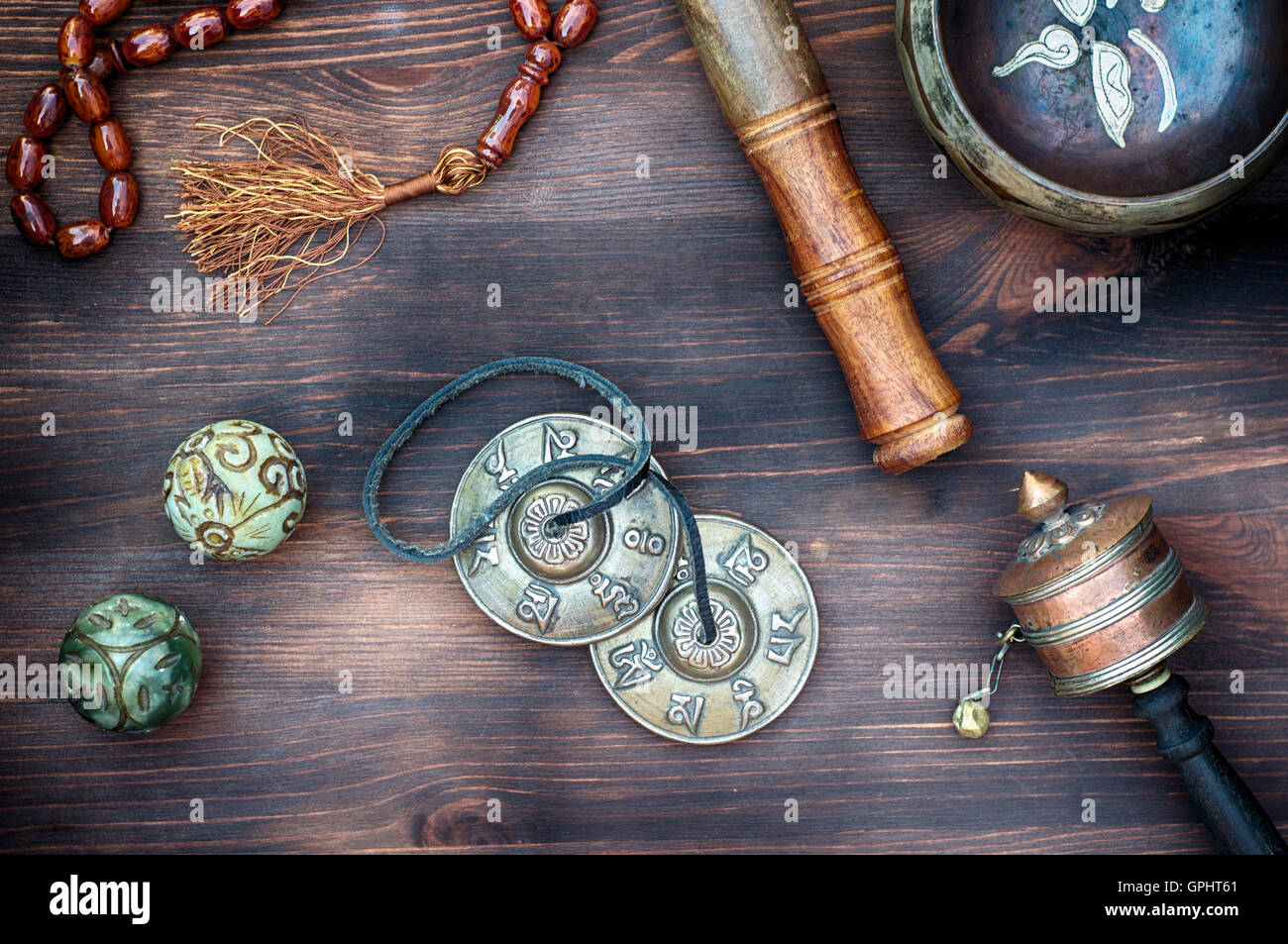tibetian singing bowls,religious drums, beads and plates, view from ...
