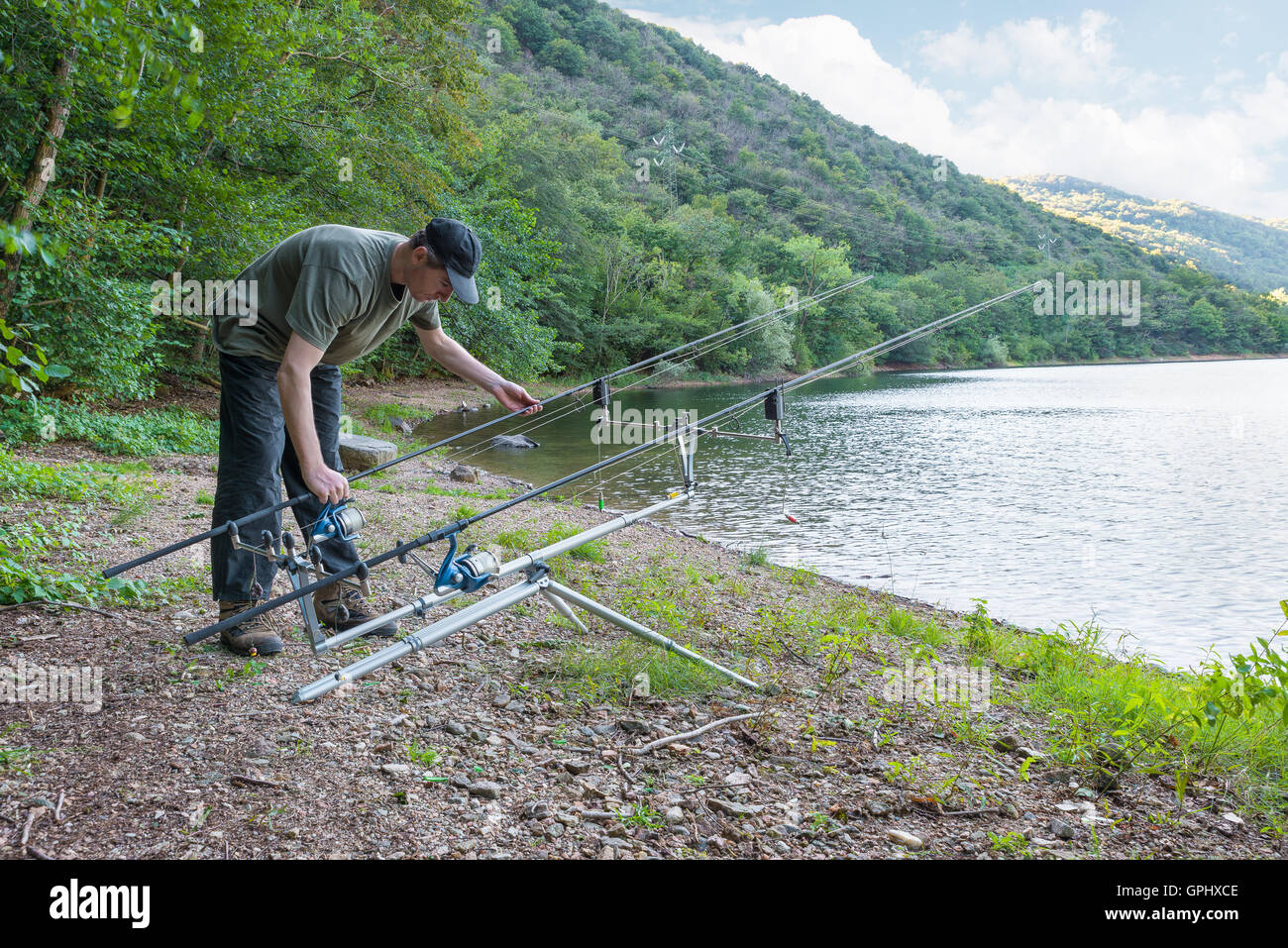 Fishing adventures . Fisherman near the fishing equipment on the