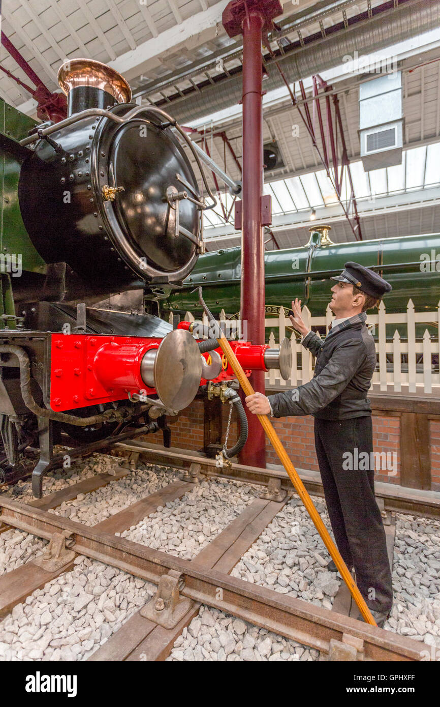 A shunter with his uncoupling pole at the Steam Museum, Swindon, Wiltshire, England, UK Stock Photo