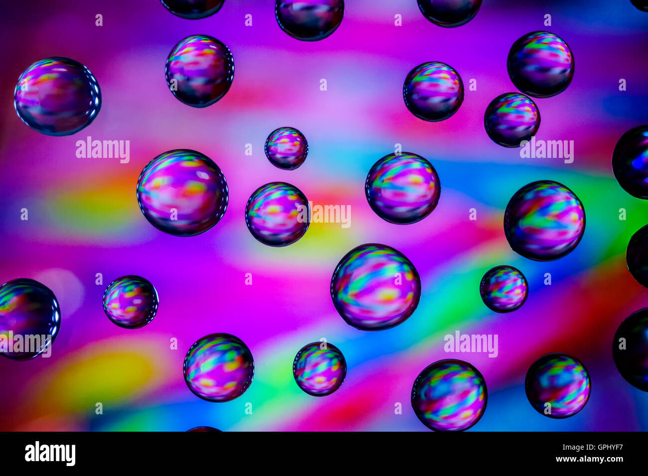 Abstract image of colorful background showing through water droplets Stock Photo