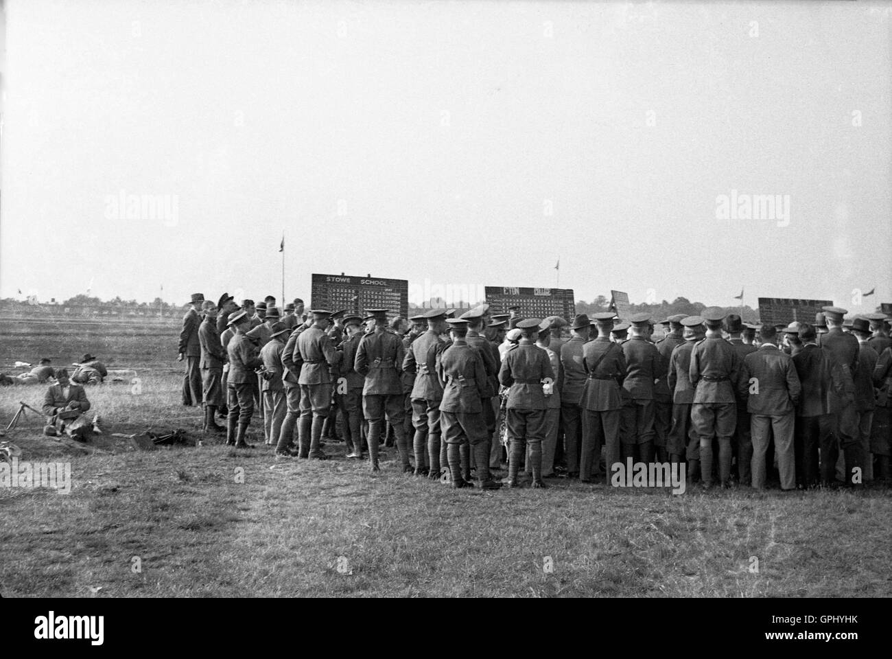 1930s, historical, military personnel gather around the scoreboards to