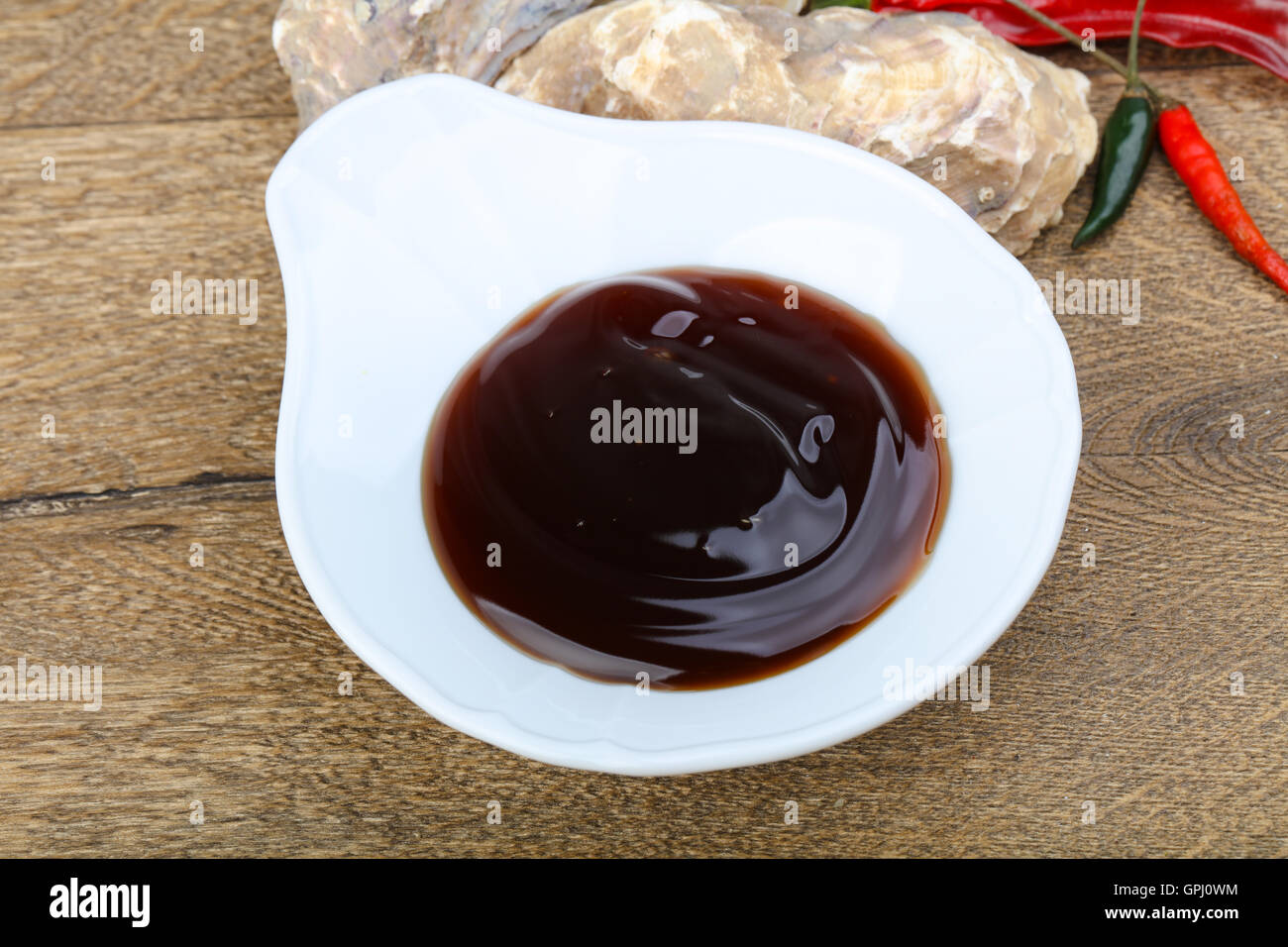 Oyster sauce in the bowl with shell Stock Photo - Alamy