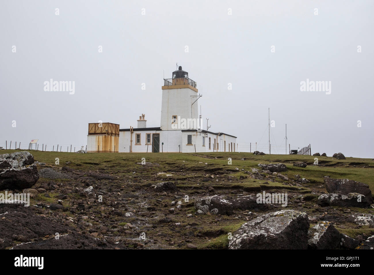 A view of Eshaness Lighthouse is situated on the Northmavine peninsula in the north-west of the Shetland Islands, Scotland. Stock Photo