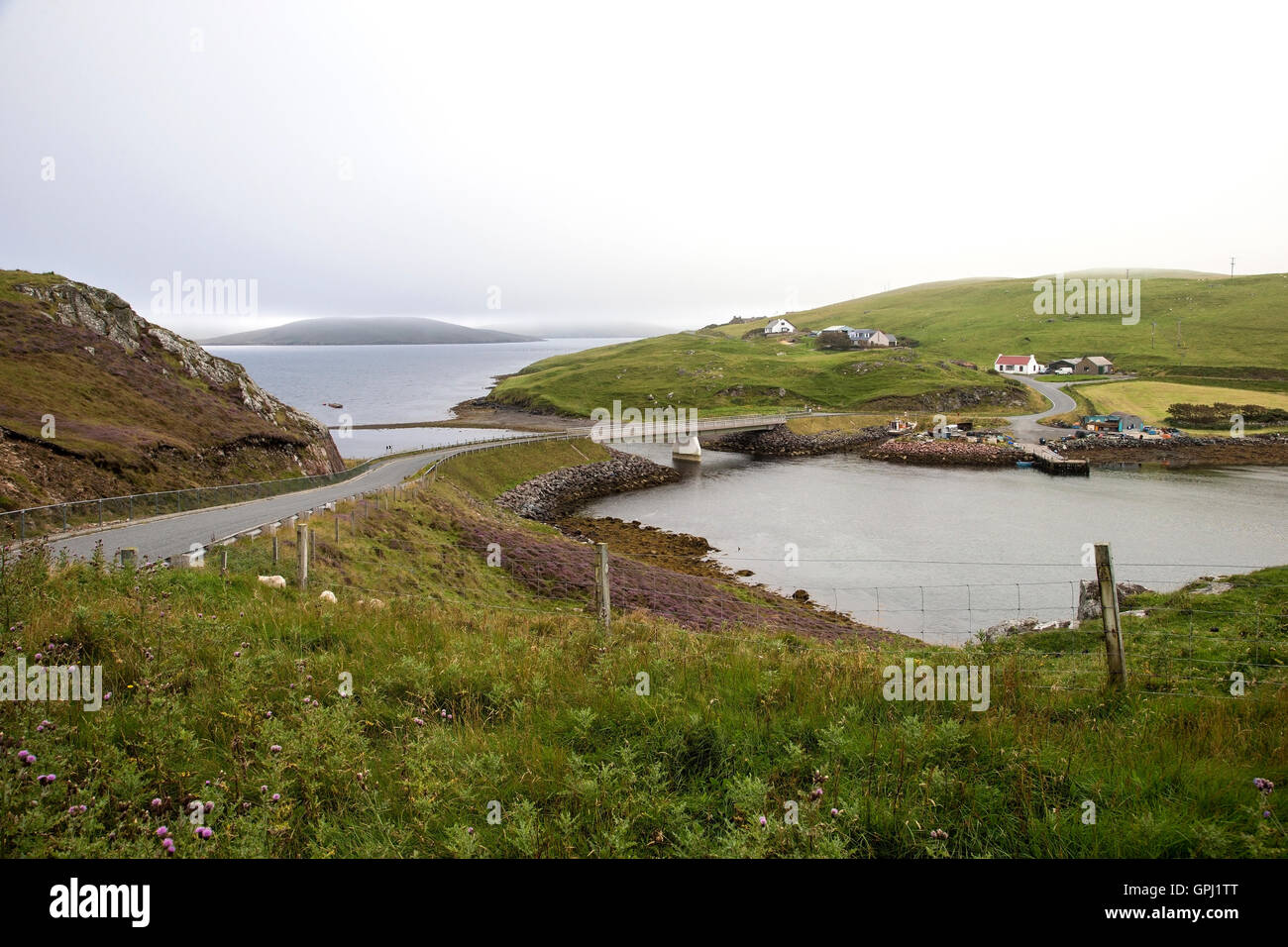 A view of the bridge providing access from Busta on the Shetland mainland to the isle of Muckle Roe Stock Photo