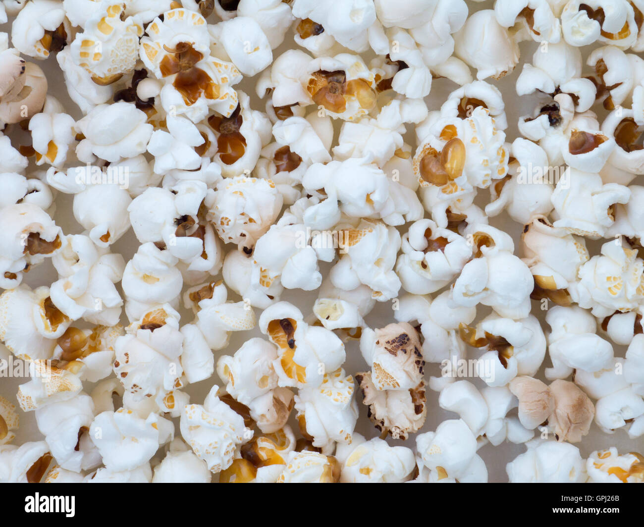 Popped corn grains on the paper background Stock Photo Alamy