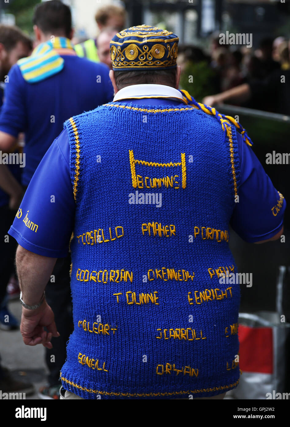 A Tipperary fan wears a hand knitted jumper as supporters make their
